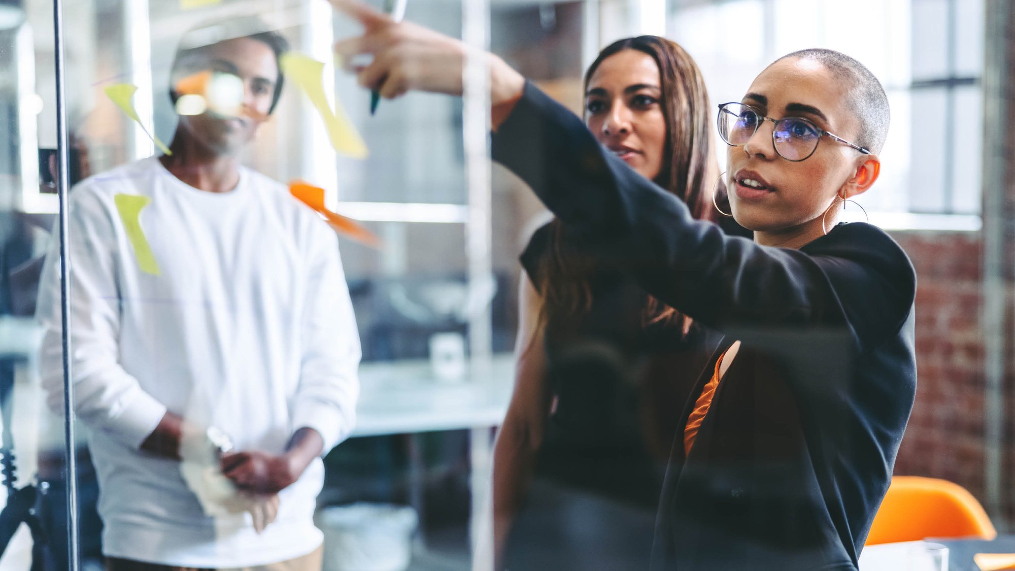 Data professionals collaborating in a meeting room.