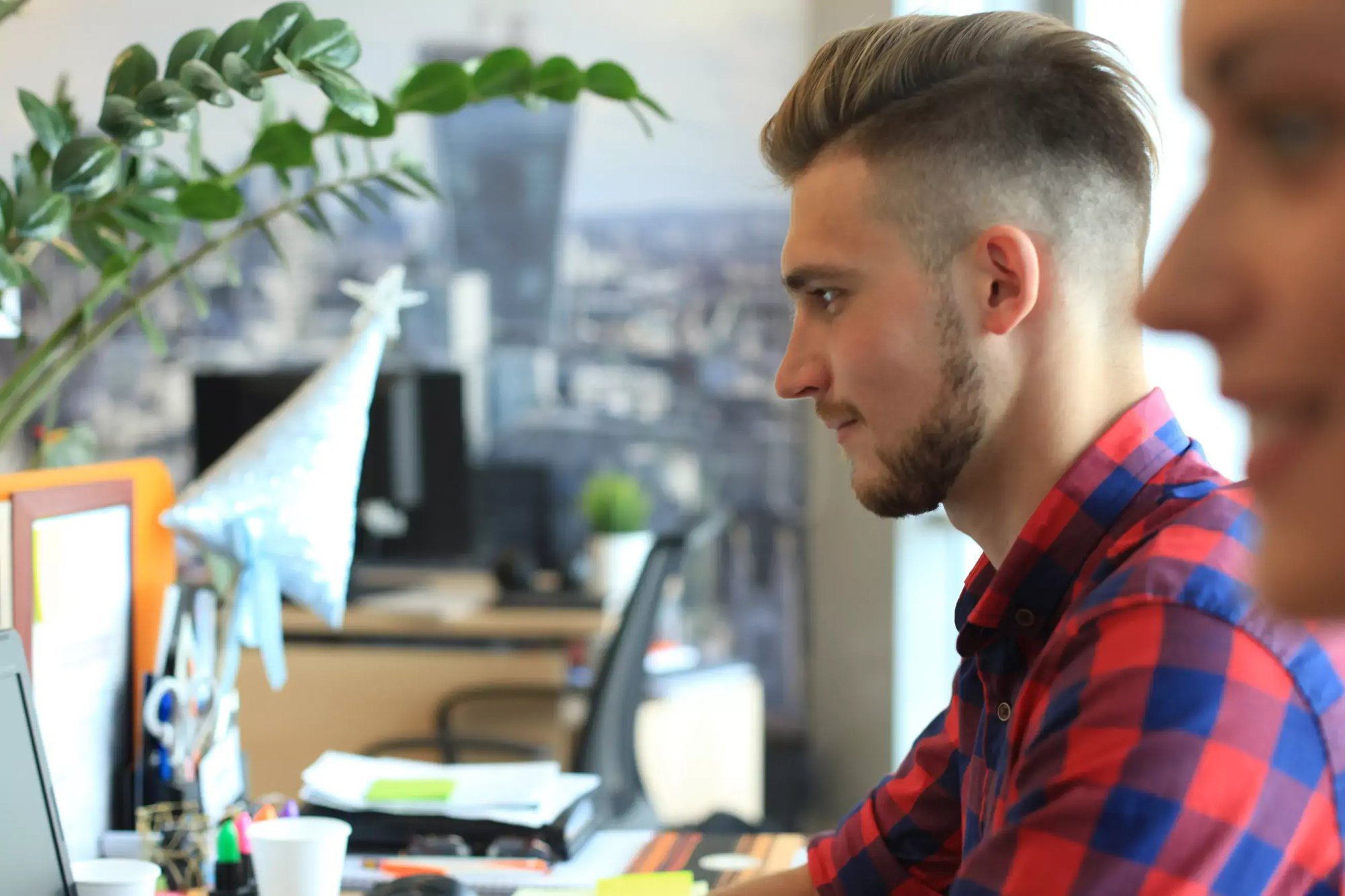 Quality engineers working at desks