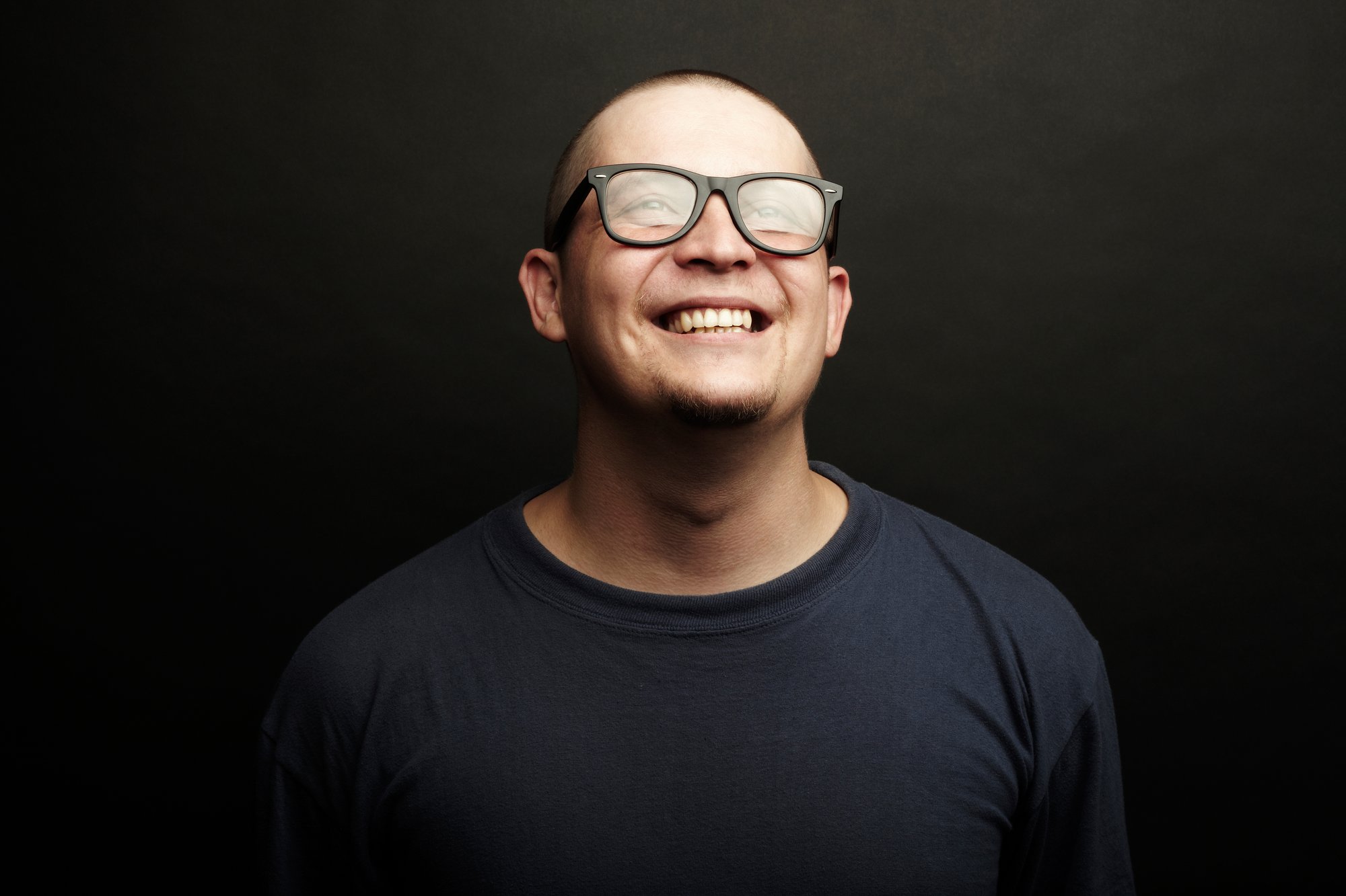 Smiling man on a black background